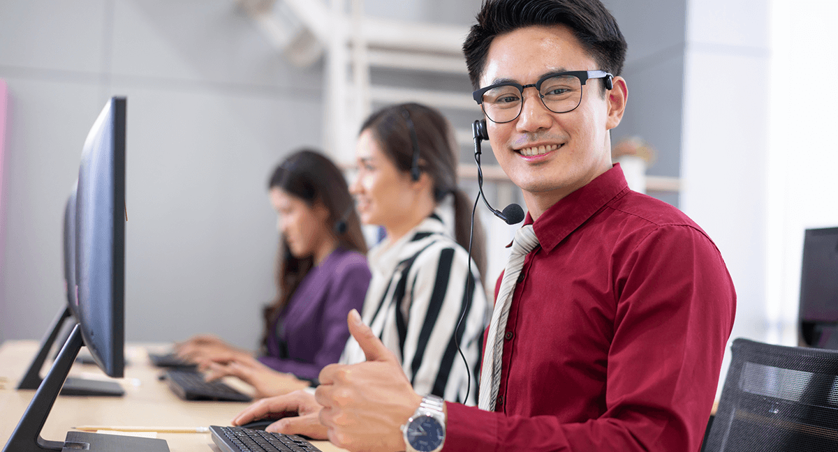 man at computer with multiple communications channels displayed via icons