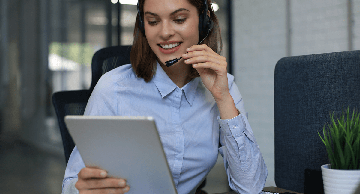 woman on computer and phone