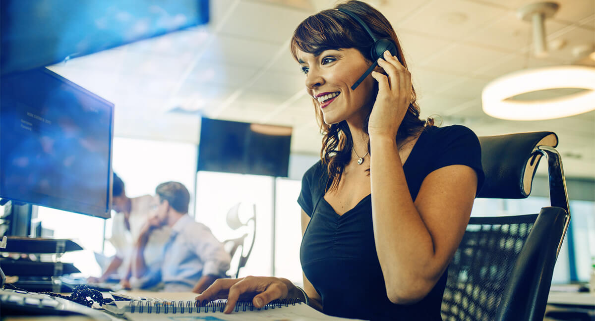 happy woman working in a cloud contact centre