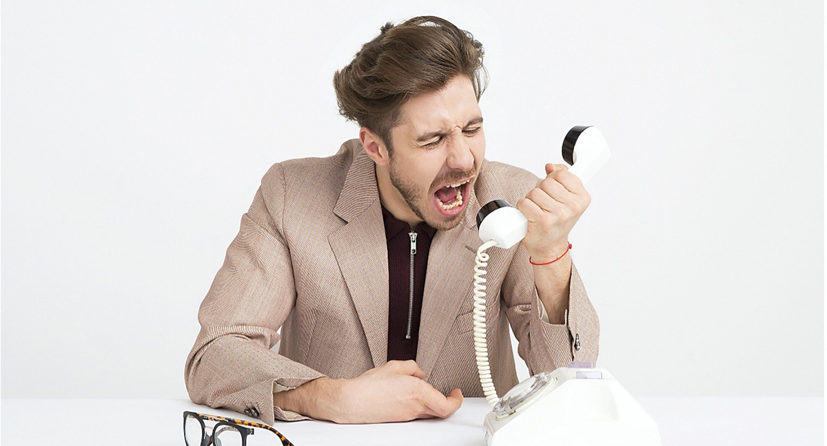 man screaming into phone