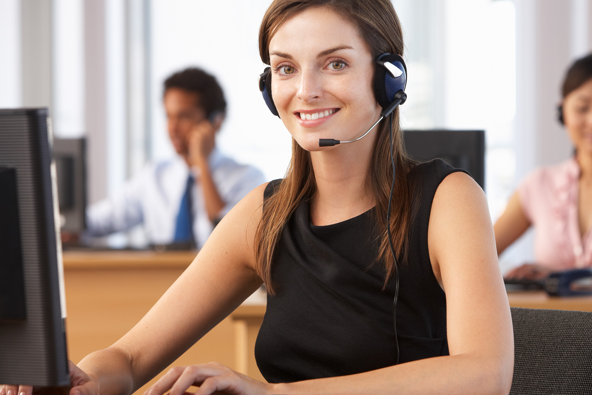woman on headset looking at camera